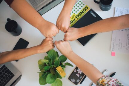 Team work, fists together